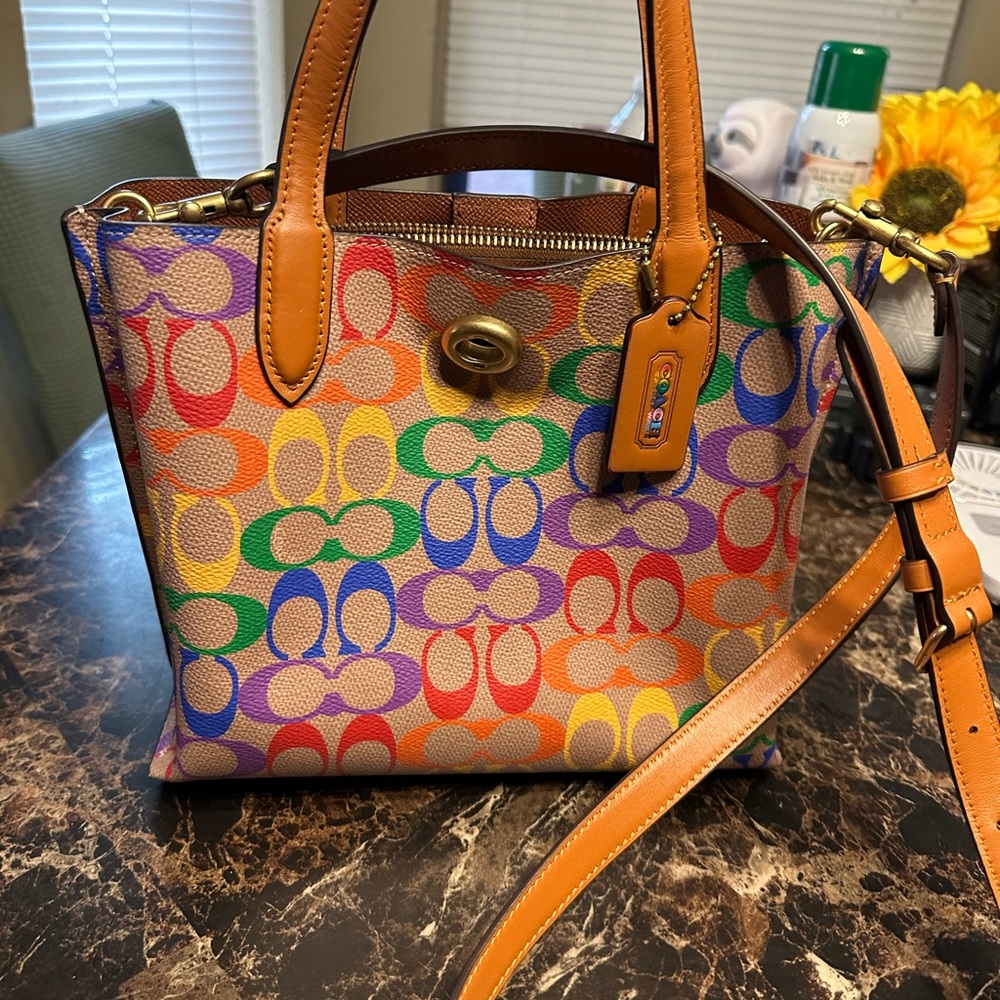 Coach, small handbag, and Crossbody strap included
